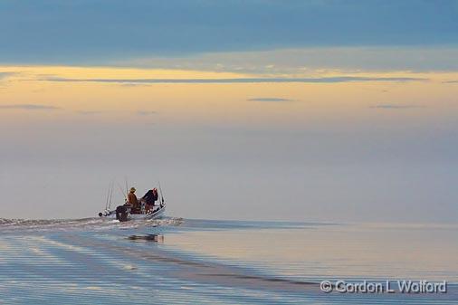 Heading Out At Dawn_27371.jpg - Fishermen heading out for a day on the lake with the distant shore obscured by fog. Photographed at Powderhorn Lake near Port Lavaca, Texas, USA.